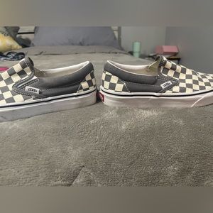 Grey and white slip on vans